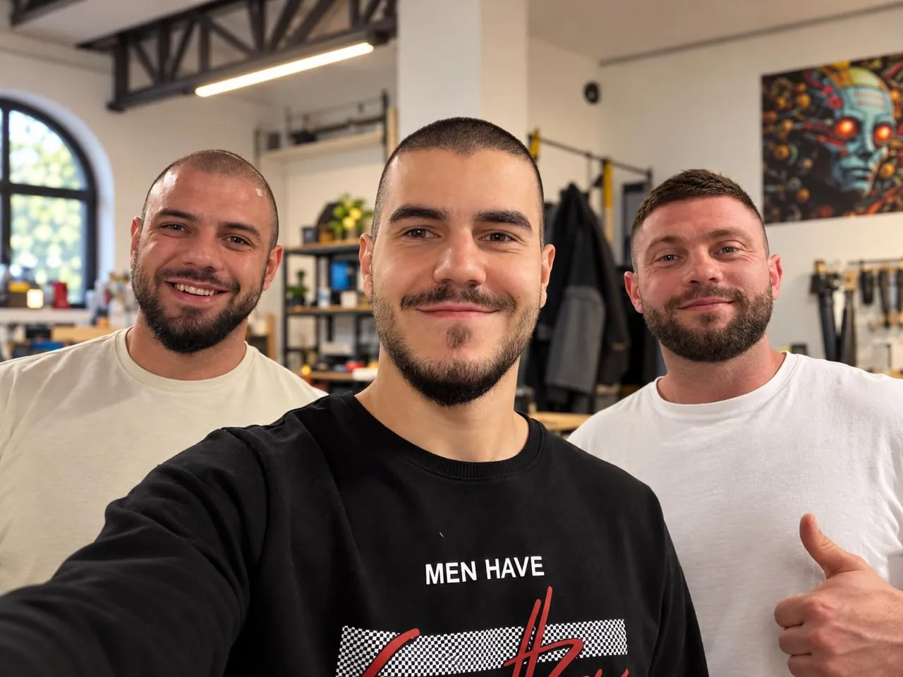 The three ID Robots founders smiling in a selfie in their workshop in Plovdiv